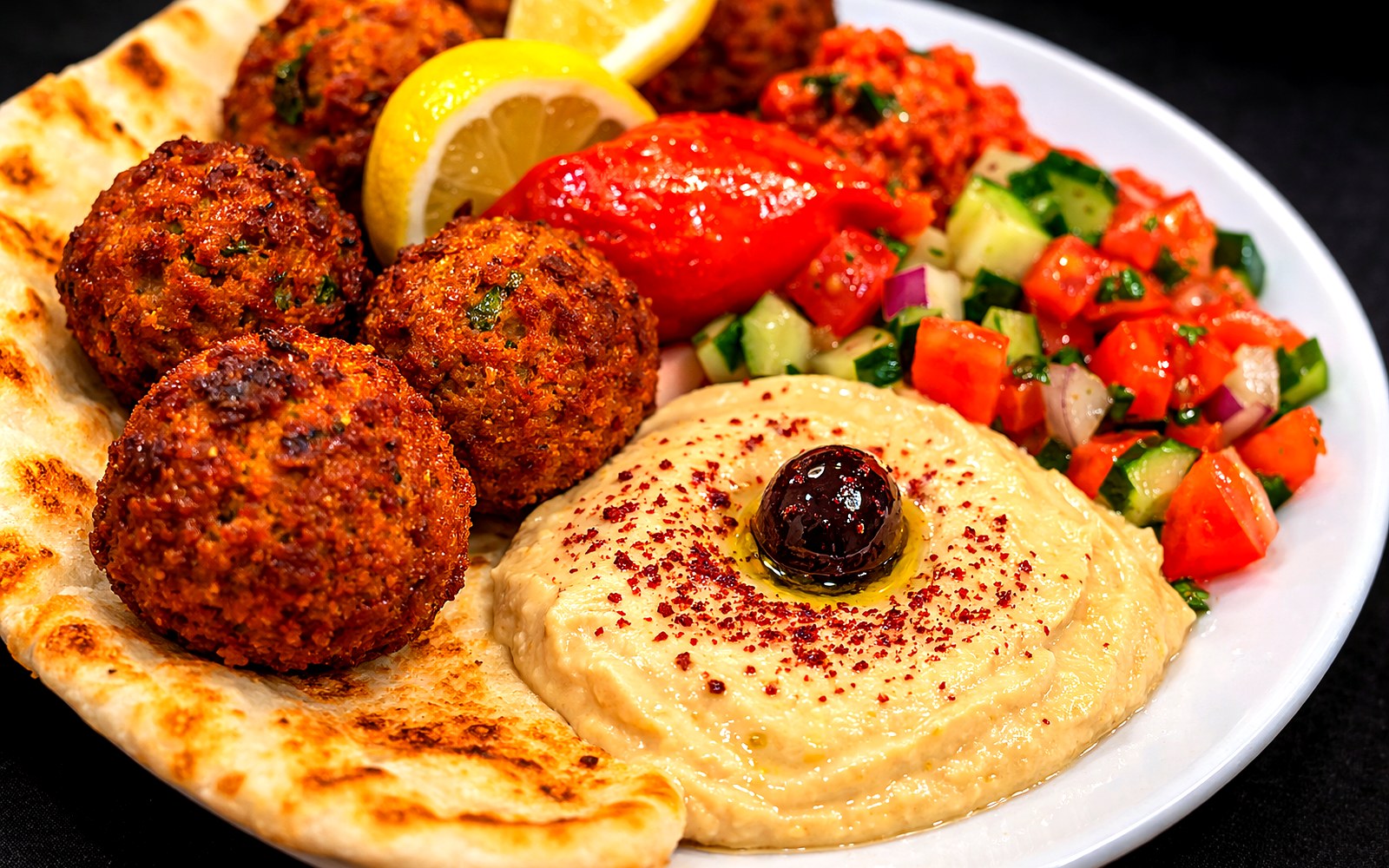 Halal catering appetizer platter with falafel and hummus